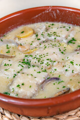 Monkfish simi tomba with clams, potatoes and alioli