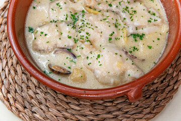 Monkfish simi tomba with clams, potatoes and alioli