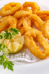 Freshly made Roman calamars with lemon wedge