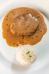 Filet mignon of veal with rice and pepper sauce