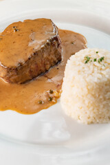 Filet mignon of veal with rice and pepper sauce