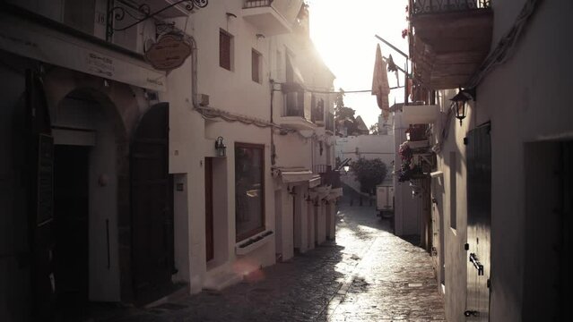Cobbled street in Ibiza old town, Dalt Vila, in the early morning sun