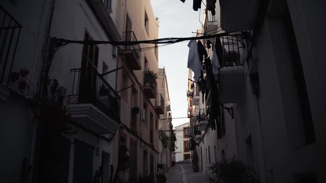 A street in Ibiza old town, Dalt Vila, with clothes hanging from the the balconies