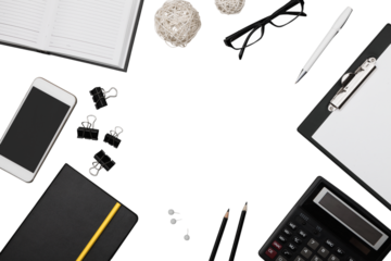 Office workspace with notebook, pen, coffee, clips and accessories.