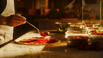 In Restaurant Professional Chef Preparing Pizza, Adding Ingredients, Cheese, Special Sauce, Traditional Family Recipe. Authentic Sunny Pizzeria with Deliciously Organic Food. Cinematic Shot