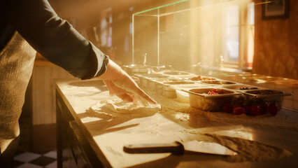 In Restaurant Professional Chef Preparing Pizza, Using Flour, Kneading Dough, Traditional Family Recipe. Authentic Sunny Pizzeria, Cooking Delicious Food. Cinematic Focus on Hands Shot