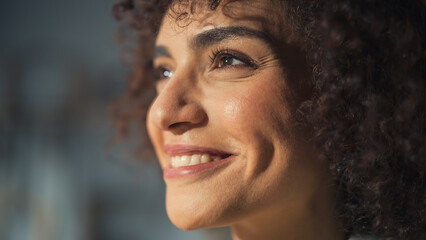 Close Up Portrait of a Multiethnic Brunette with Curly Hair and Brown Eyes. Happy Creative Young...