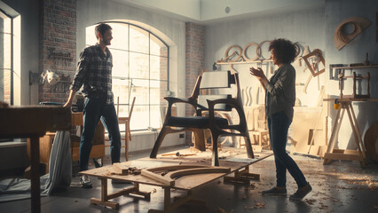 Furniture Designer Presenting His New Armchair to a Female Colleague or Client. Carpenter Removing...