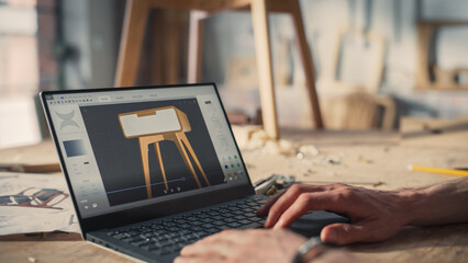 Handsome Furniture Designer Working on Laptop Computer, Creating a Digital 3D Model of a Stylish...