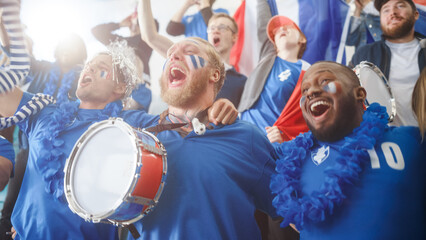 Sport Stadium Big Event: Three Diverse Fans with Painted Faces Cheering, Beating the Drum,...