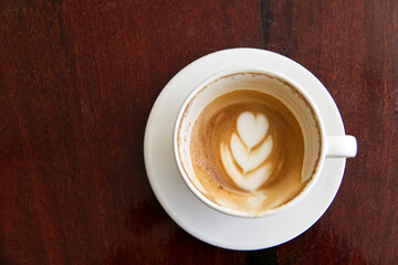 cup of coffee on wooden table