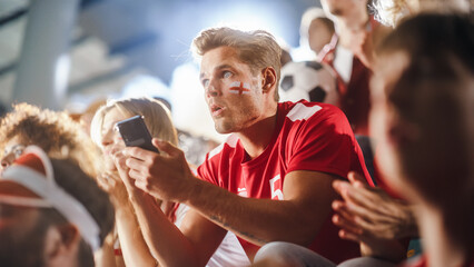 Sport Stadium Event: Handsome Caucasian Man Cheering. Crowd of Fans with Painted Faces Shout for...