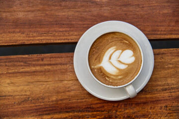 cup of coffee on wooden table