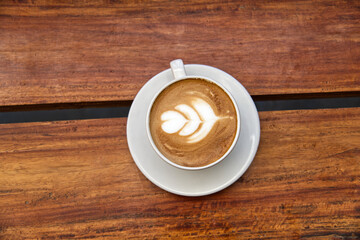 cup of coffee on wooden table