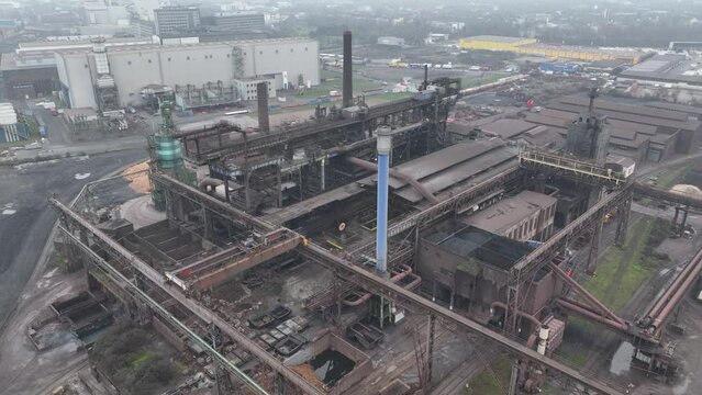 Blast furnice and industrial recycling company. Sintering, zinc production, furnace and casting. Steel industry factory plant. Aerial drone overhead view. Heavy industry in Germany.