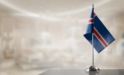 A small Iceland flag on an abstract blurry background