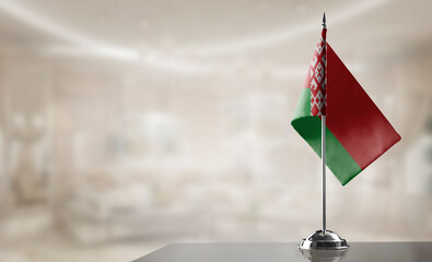 A small Belarus flag on an abstract blurry background