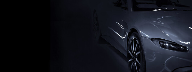 Detail front headlights of sport car on black background,copy space