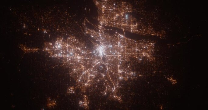 Portland (Oregon, USA) aerial view at night. Satellite view on modern city with street lights. Camera is flying above the city, moving forward