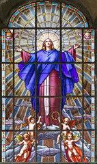 VARALLO, ITALY - JULY 17, 2022: The Assumption in the stained glass of church Collegiata di San Gaudenzio by unknown artist of 19 . cent. - obrazy, fototapety, plakaty