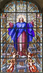 Tuinposter VARALLO, ITALY - JULY 17, 2022: The Assumption in the stained glass of church Collegiata di San Gaudenzio by unknown artist of 19 . cent. © Renáta Sedmáková