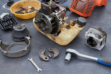 repair a broken brush cutter,disassembled the old brush cutter, replaced the piston