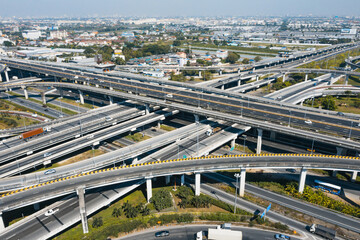 Multilevel junction motorway top view, Road traffic an important infrastructure in Thailand. Expressway Road and Roundabout. Transportation and travel concept.	