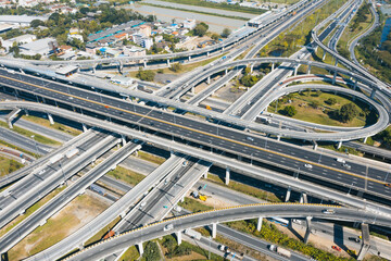 Multilevel junction motorway top view, Road traffic an important infrastructure in Thailand. Expressway Road and Roundabout. Transportation and travel concept.	