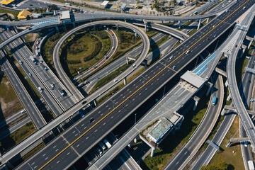 Aerial top view of Cars passing through the Automatic Point of Payment on motorway Toll Road. Point of toll highway, Toll Station. Highway toll plaza or Turnpike or Charging point, Expressway