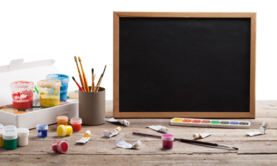 Artist's workshop. Canvas, paint, brushes, palette knife lying on the table.