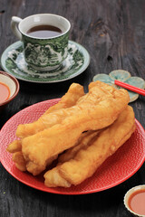 Youtiao or Cakwe, Chinese Oil Bread for Breakfast, Served with Tea