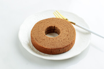 Chocholate Baumkuchen  Germany Dessert on White Table.