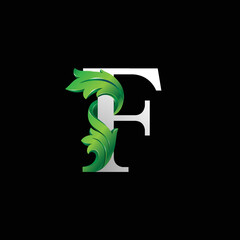 Initial letter F, 3D luxury green leaf overlapping white serif font on black background