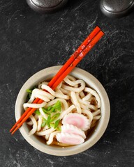Top View Japanese Kake Udon with Narutomaki Topping