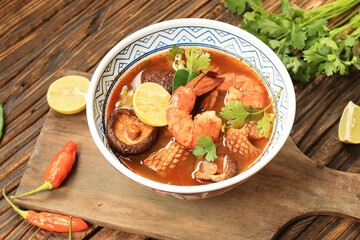 Tom Yum Kung Spicy Thai Soup with Shrimp and Squid in a Chinese Ceramic Bowl