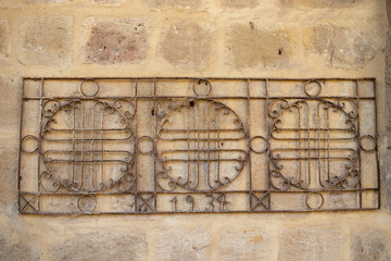 old wrought iron wall decoration, close-up.