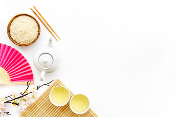 Asian tabble setting with tea set and rice bowl