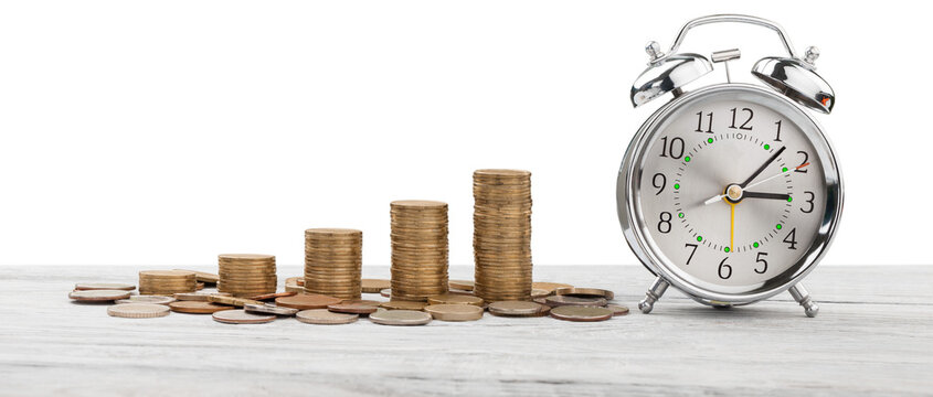 Stack golden coins with alarm clock, Save  time money concept