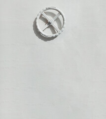 creative look, white valve on a white wall, space for text
