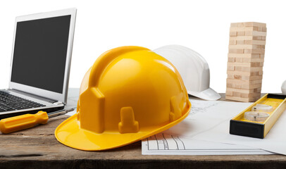 Blueprints and tools with hardhats on construction blueprint