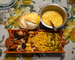 Madrid stew complete with chickpeas, green beans, stuffing, chorizo, black pudding, bacon,...