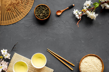 Asian tabble set with tan and cherry blossom branch, top view