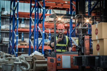 engineer in helmets order and checking goods and supplies on shelves with goods background in warehouse.logistic and business export ,Warehouse worker checking packages on shelf in a large store