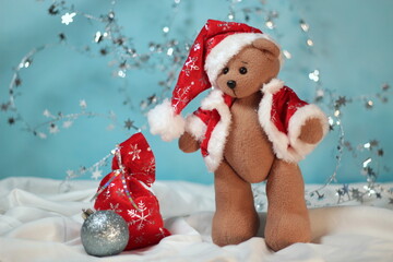 christmas teddy bear in the snow