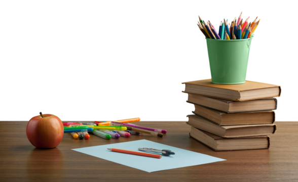 A school desk with stack of books and stationery