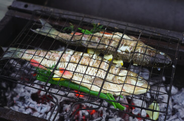 White fish cooked on charcoal, close up photo.