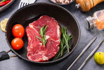 Fresh beef steak on a concrete background