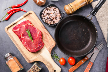 Fresh beef steak on a concrete background