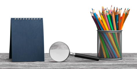 he calendar and colored pencil in a jar on the school table