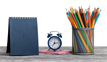 The calendar and colored pencil in a jar  on the school table